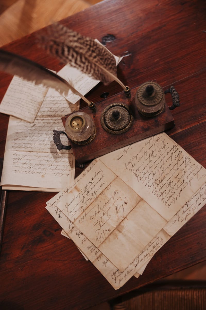 Quill, inkwell and folded letters recreating Vincent's correspondence with Theo