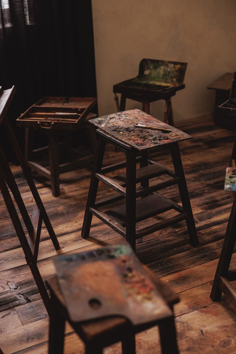 Wooden easels and paint palettes in the studio recreation